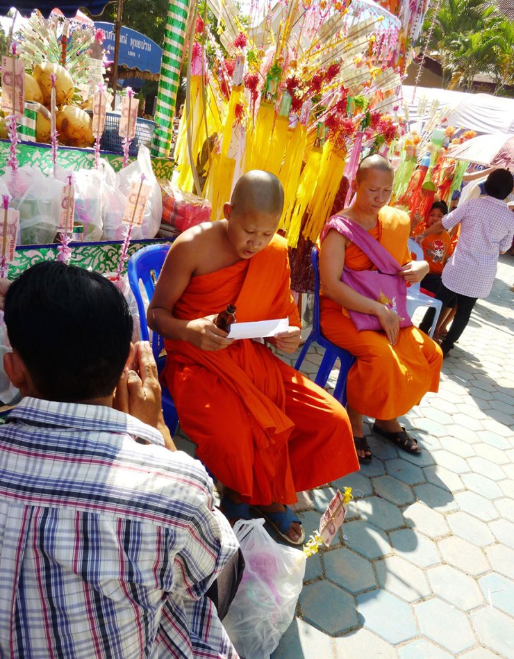 After the names have been found, a monk reads and blesses.