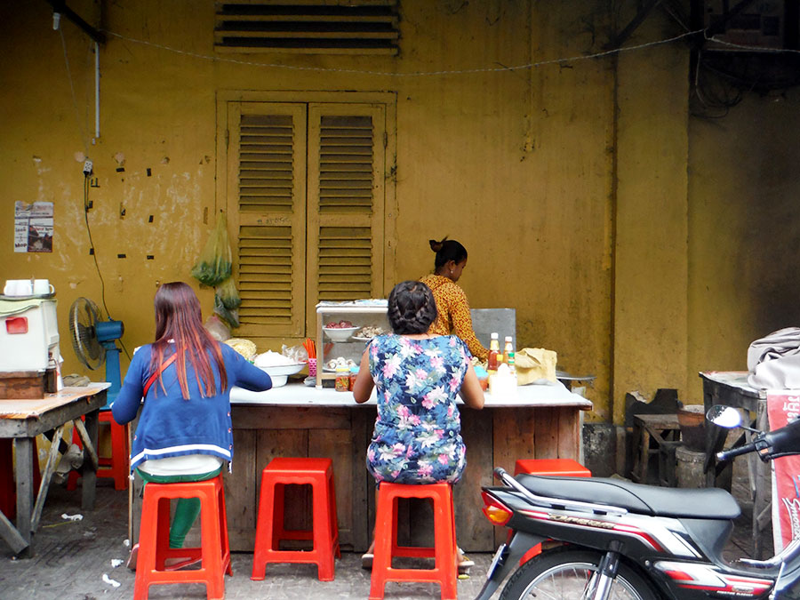 women eating in battambang