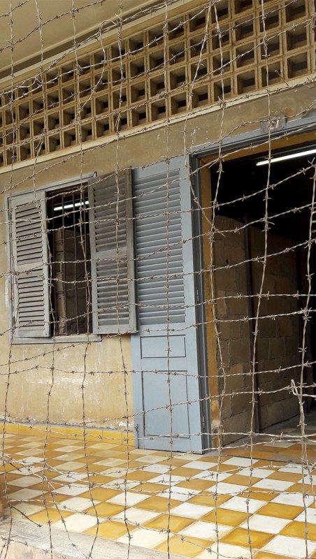 After a prisoner committed suicide from the 3rd story, the Khmer Rouge covered the building in wire to prevent others from ending their suffering.