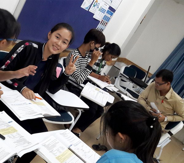 Khmer student giving the peace sign
