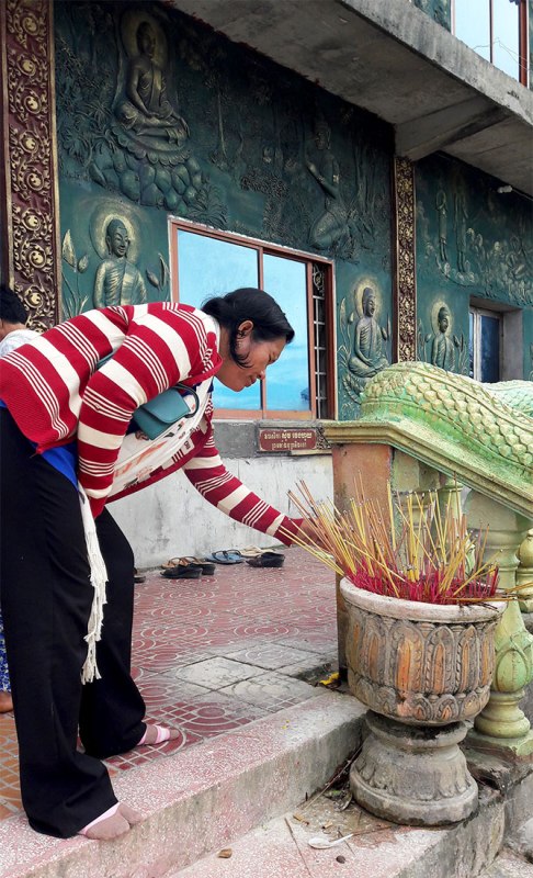 "Making merit" at Bokor Mountain pagoda, Kampot
